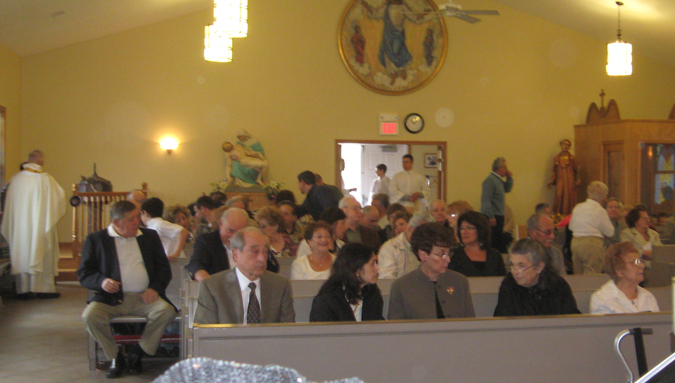 Before Easter Sunday Mass, 2011, every available place is occupied. Full House.
