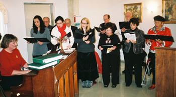 Christmas Mass: Marty Kabbes Hesse, pianist, and St. Rocco Choir